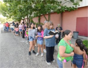 Families wait in line for hours to get in.